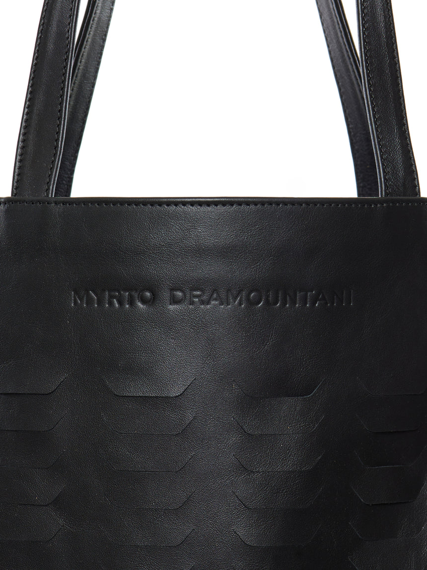 Black laser-cut leather bag